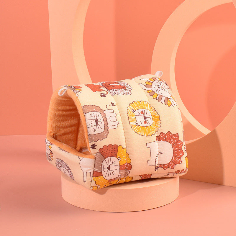 Cozy hamster nest in cotton velvet with fun lion designs, perfect for small pets, displayed on a contemporary pedestal.