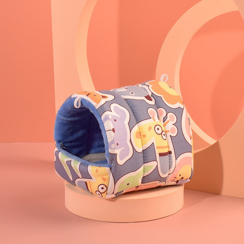 Cozy hamster nest in colorful animal print, perfect for small pets to snuggle and sleep comfortably.