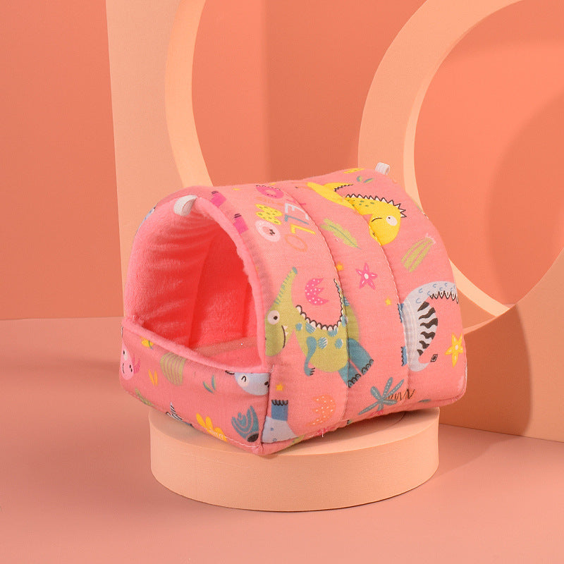 Cozy pink hamster nest with fun animal designs, perfect for small pets, made of soft cotton velvet.